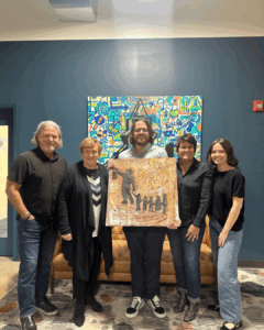 Crosser Family poses with art